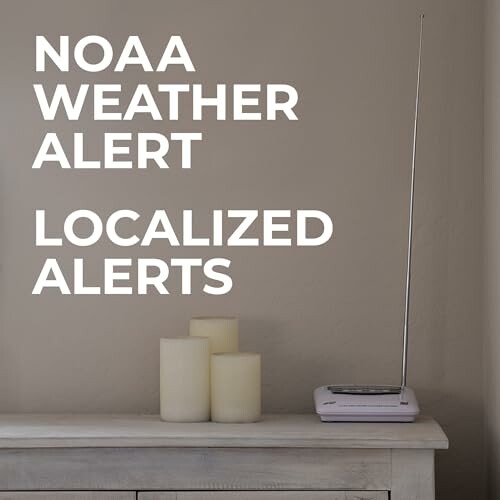 NOAA weather alert radio with candles on table